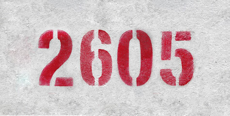 number 2605 . Red spray paint the white wall