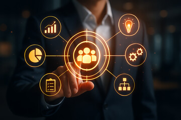 Businessman touching glowing digital screen with orange icons for team management data analysis growth planning innovation process and business structure strategy