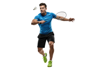 Energetic man playing badminton with racket and shuttlecock