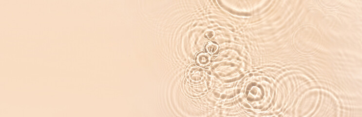 water texture ripples wave clean transparent water abstract background in beige color