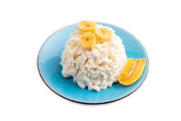 White Сottage cheese, Curd, with Banana isolated on white, side view, close up.