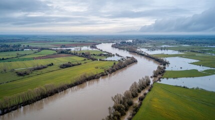 Flooded River Landscape With Overflowing Fields. Aerial View Of River Flooding Agricultural Land