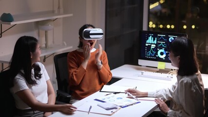 Office workers exploring virtual reality during a meeting, interacting with data and visualizations, showcasing innovative technology in a modern workplace - Powered by Adobe