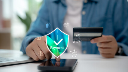 Person making secure online payment using credit card and fingerprint scan. Concept of digital...