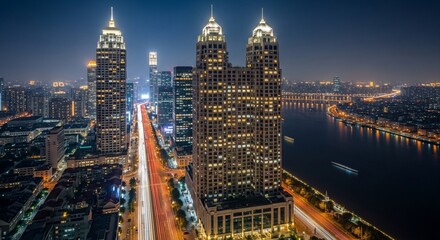 Illuminated Shanghai Skyline at Night with River and City Lights in China