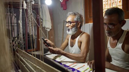 Two skilled men weaving intricate silk fabric on a traditional handloom in a small village workshop in Varanasi, India, showcasing fine Indian textile craftsmanship. - Powered by Adobe