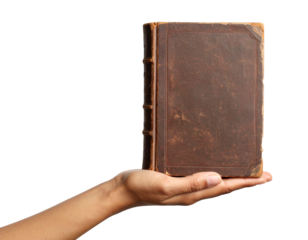 A hand gently holds up a worn, antique book with a dark brown cover, isolated on transparent background.