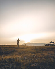 Silhouette of a traveller in an early morning on the hills in Koraput, Odisha, India in November 2024....