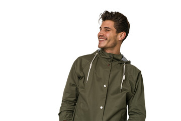 Young handsome caucasian man isolated on white background relaxed and happy laughing, neck stretched showing teeth.