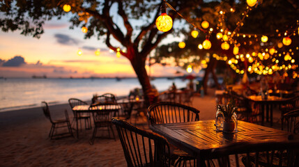 Fototapeta premium A cozy beach restaurant at sunset, with warm string lights creating a dreamy, inviting atmosphere.