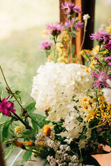 A bouquet of wild flowers on the window
