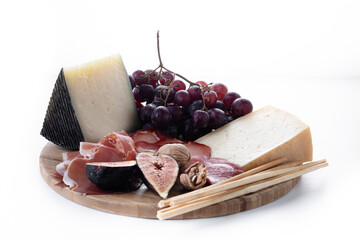Charcuterie Board with Cheese, Grapes and Figs isolated on white background 