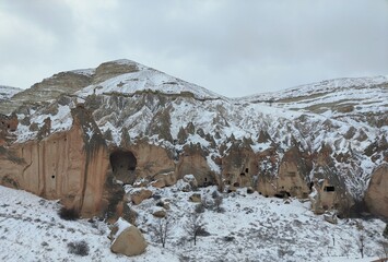 Snow covered mountains; Chimneys; Cappadocia; Turkey