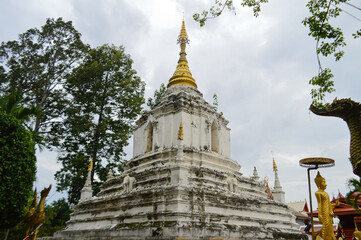 Fototapeta premium White Pagoda, Lanna Architecture, Symbols of Buddhism, South East Asia at Wat Chang Kam or Wat Kan Thom, Wiang Kum Kam Chiang Mai, Northern Thailand