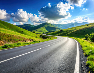 Naklejka premium A long, winding road stretches through vibrant green hills under a bright blue sky with fluffy white clouds.