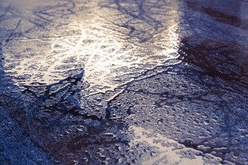 Wet texture bacground. Macro shot of water drops scattered over a wooden table, creationg a textured and fresh background for nature or abstract themes. Dramatic and contrast look, moody lighting