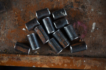 Metal bars. Cut metal fittings. Pieces of metal on the background.