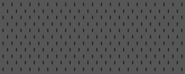 Pegboard peg board gray wall with dots, holes in geometric grid pattern. Perforated panel for hooks, diy construction. 