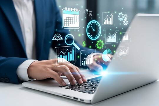 Person in dark blue suit using laptop with digital analytics interface business data