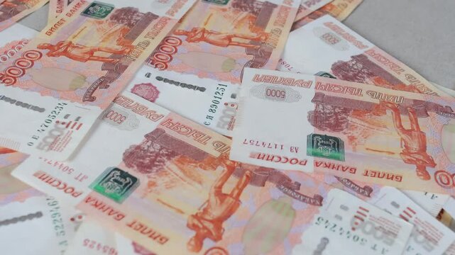 Russian rubles fall on the table in five thousand bills, video 4k