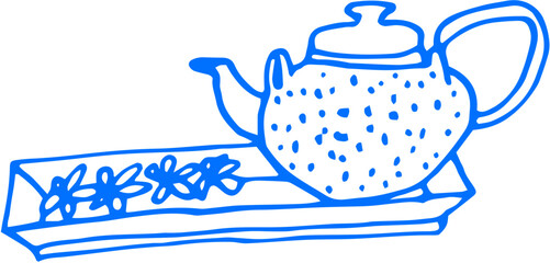 A teapot and a cup on a tray — classic serving moment