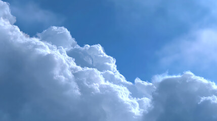 A beautiful view of fluffy clouds against a bright blue sky, showcasing the serenity and beauty of nature in the atmosphere.