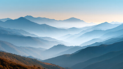 Obraz premium A breathtaking view of misty mountains capturing the serene beauty of nature at dawn.
