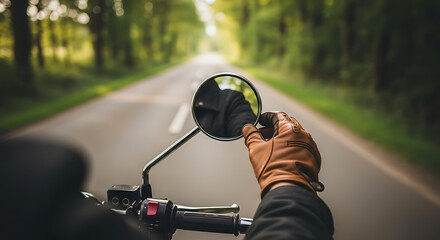 Bikers hand in a classic brown leather glove adjusting a round chrome side-view mirror.