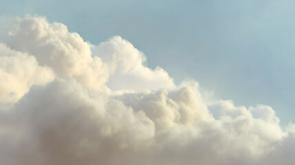 Fluffy white clouds float serenely against a soft blue sky, creating a peaceful and calming atmosphere for nature lovers.