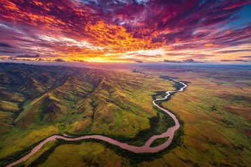 Aerial view of a winding river valley at sunrise