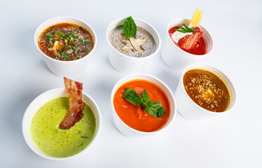 Variety of soups from different cuisines, restaurant hot dishes, healthy food - japanese miso soup, asian fish soup, russian borscht, english pea soup, french mushroom soup, spanish gazpacho isoalted