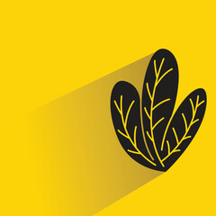leaf with shadow on yellow background