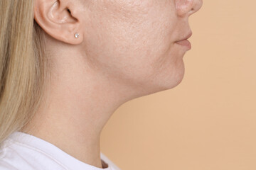 Fototapeta premium Closeup view of woman on beige background, space for text