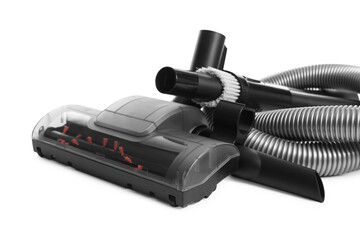 Vacuum cleaner brushes and hose on white background