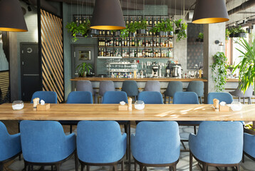 Modern cafe with places for rest and eating with big counter, cozy interior