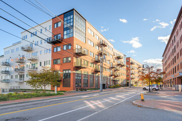 New luxury blocks of apartments along a street in a central residential district on a sunny autumn day