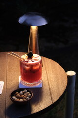 Blueberry cocktail under dim lighting © onur