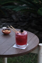 Blueberry cocktail under dim lighting © onur
