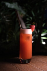 Strawberry mojito on the table. Strawberry drink in the cafe at night.