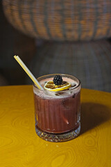 Blueberry cocktail under dim lighting © onur