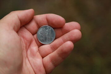 Italian change coin in hand