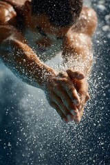 Diver performing a springboard dive with water splashing around in a dynamic underwater scene