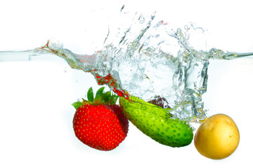 Fresh Cucumber Strawberry And New Potato Splashed In Water