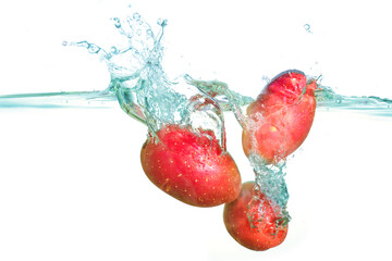 Fresh Red Potatoes Splashed into Clear Water with Bubbles and Ripples