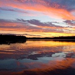 Fototapeta premium Generated image Rippled Water Surface Reflecting Sunset Sky