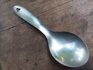 spoon or rice ladle on a wooden table