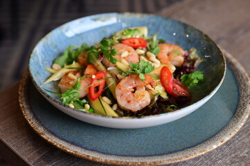 Spicy salad with prawns and vegetables, Thai food.