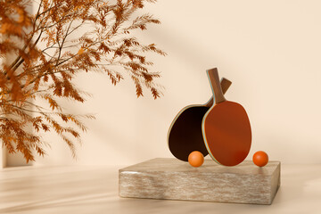 Table tennis paddles and balls displayed on a block with autumn decor. 3D rendering