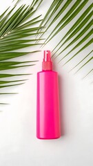 Pink Spray Bottle with Palm Leaf on White Surface