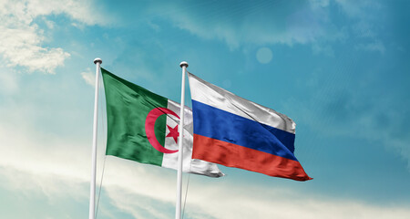 Algeria and Russia friendship flags are waving in the sky. Double country Flag waving with mast. Algeria Russia national flag for agreement.
